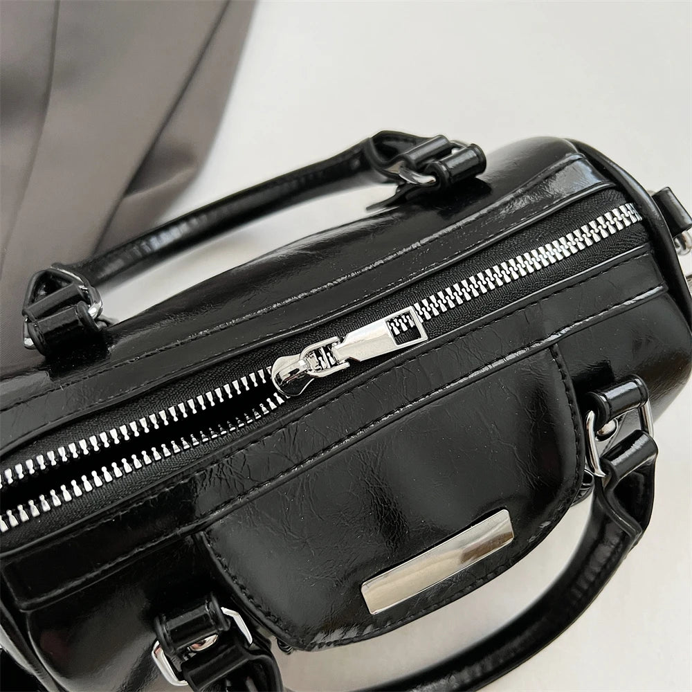 Mini top-handle crossbody bag, black PU leather with silver hardware and front metal plate