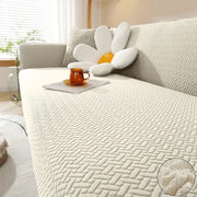 Jacquard elastic sofa cover in beige polar fleece for L-shaped sofas