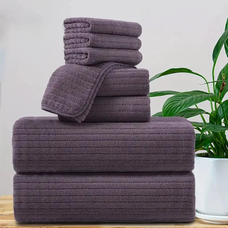 8-piece bath towel set in plum purple; includes 4 washcloths, 2 face towels and 2 bath towels; absorbent and quick-dry.