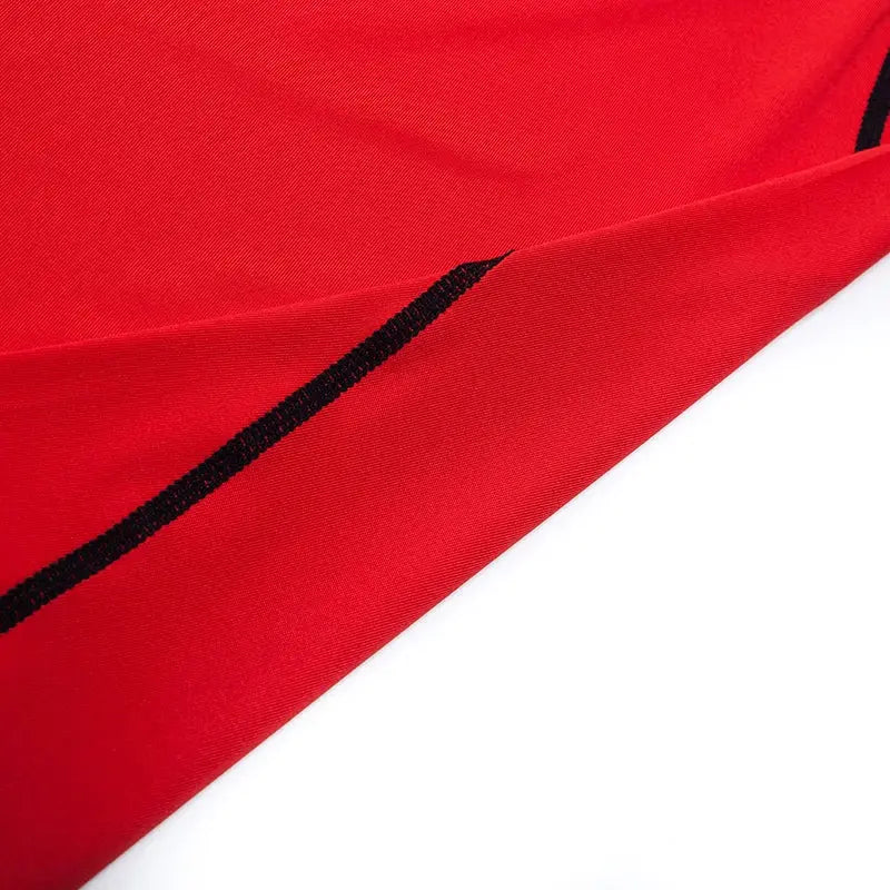 Men's red running compression T-shirt with black stitching on athletic fabric
