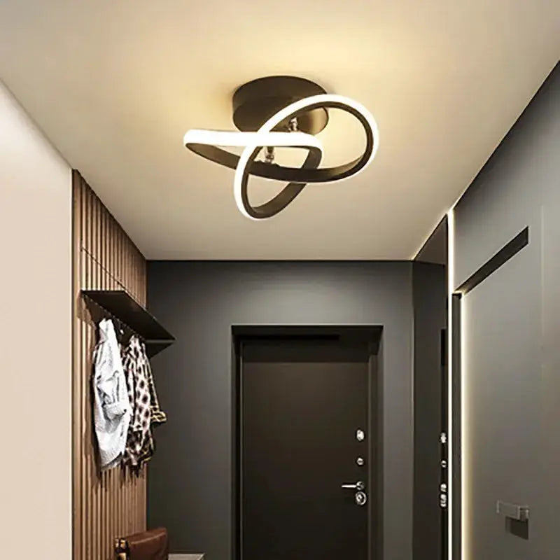 LED strip ceiling light by Simples Market; black intertwined loop design for modern living spaces
