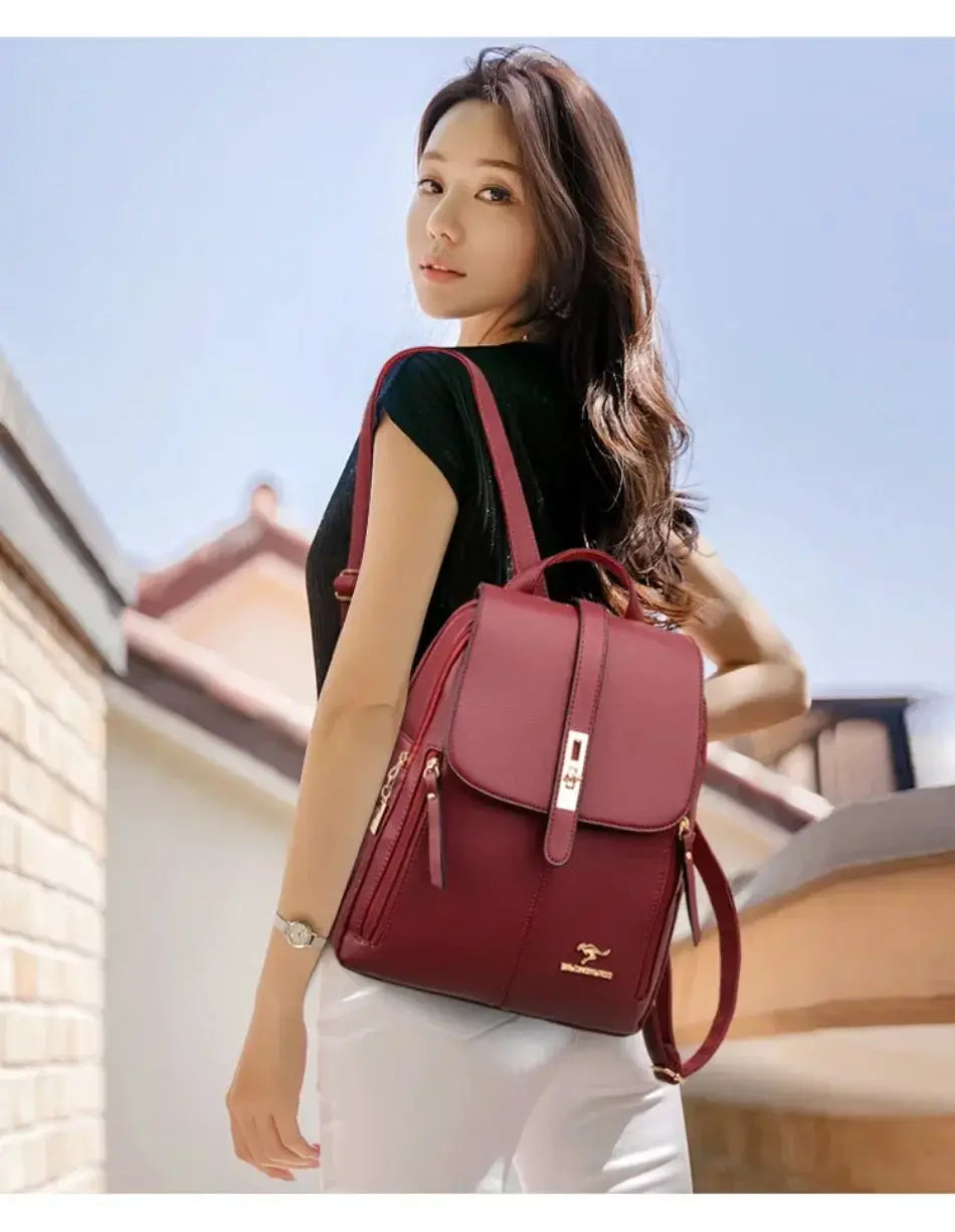 Women’s burgundy leather backpack by Simples Market, large-capacity travel and school bag with gold hardware.
