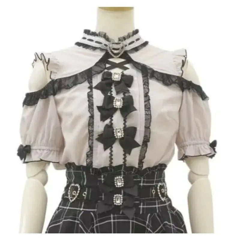 Sweet Lolita off-shoulder blouse in pale pink with black lace trim and bow details