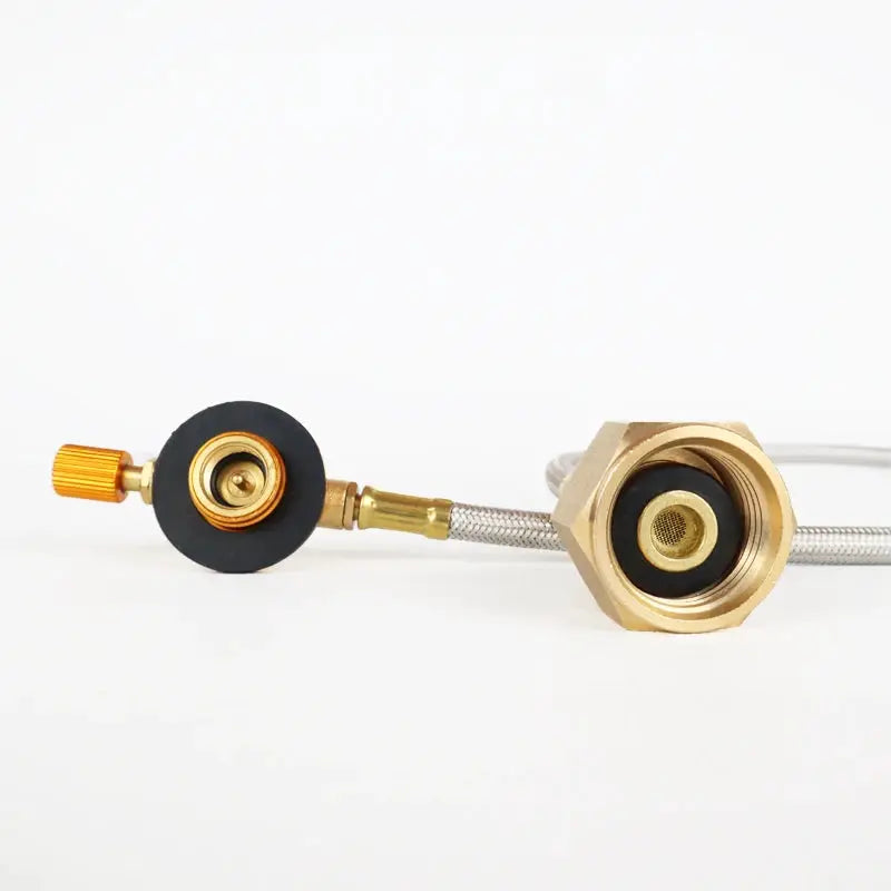 Camping gas refill adapter with brass hex connector and braided hose.