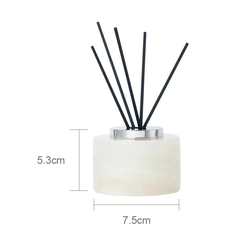 White onyx marble bathroom accessories set with diffuser bottle and black reed sticks