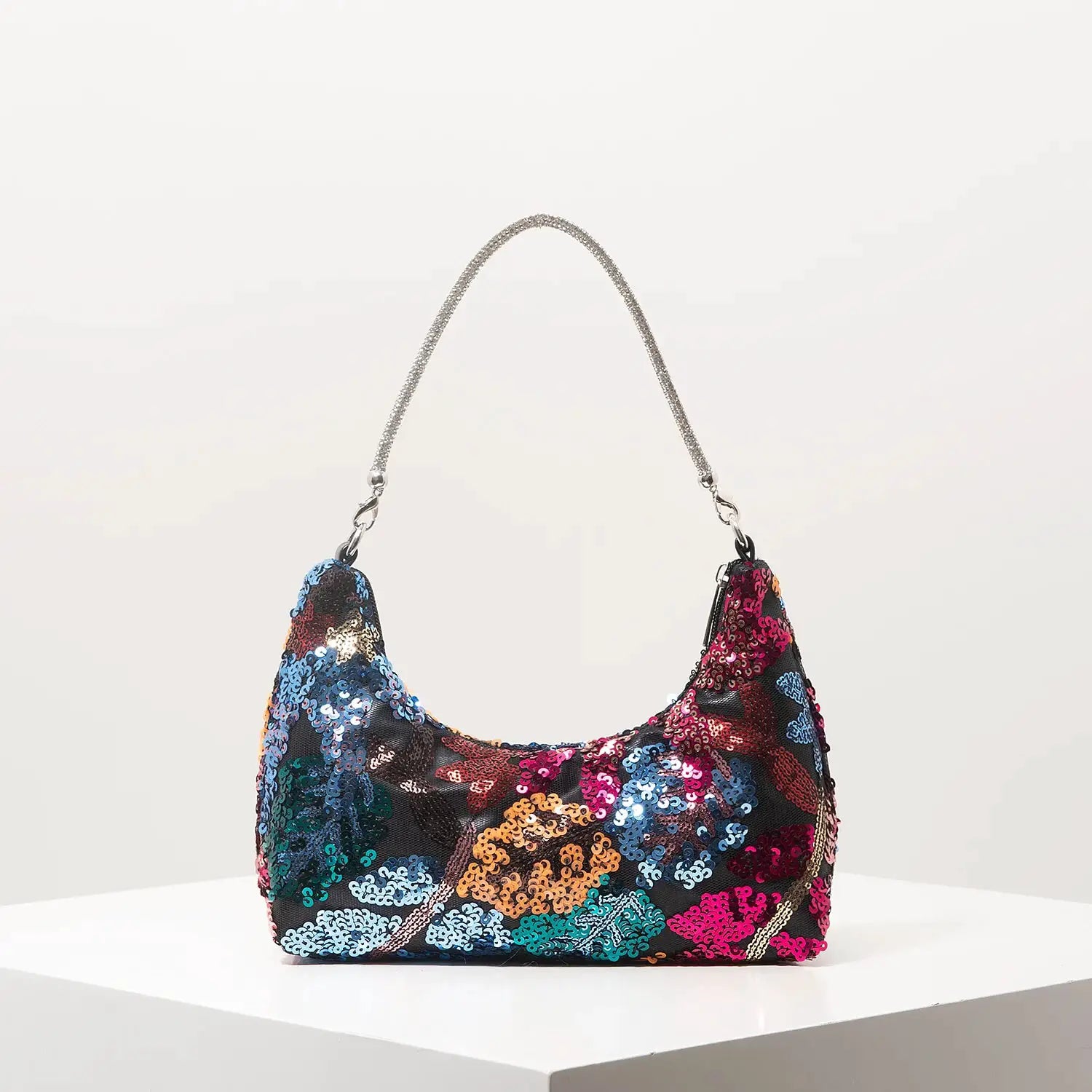 Shoulder bag by Simples Market with multicolor sequin floral embroidery and a silver glitter strap