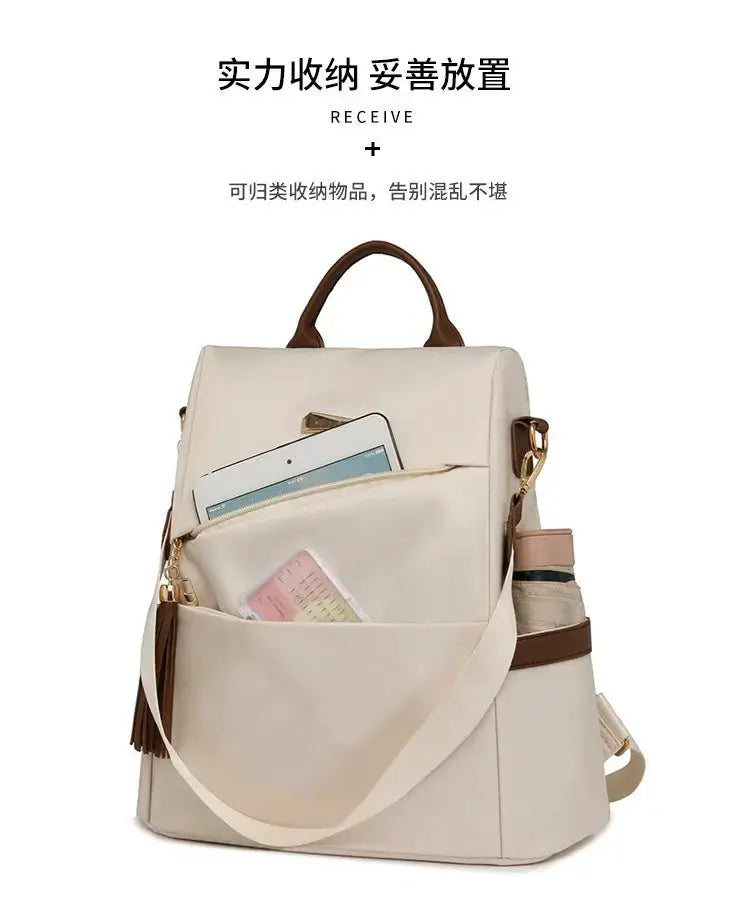 Women’s nylon anti-theft backpack by Simples Market, beige with tassel accents