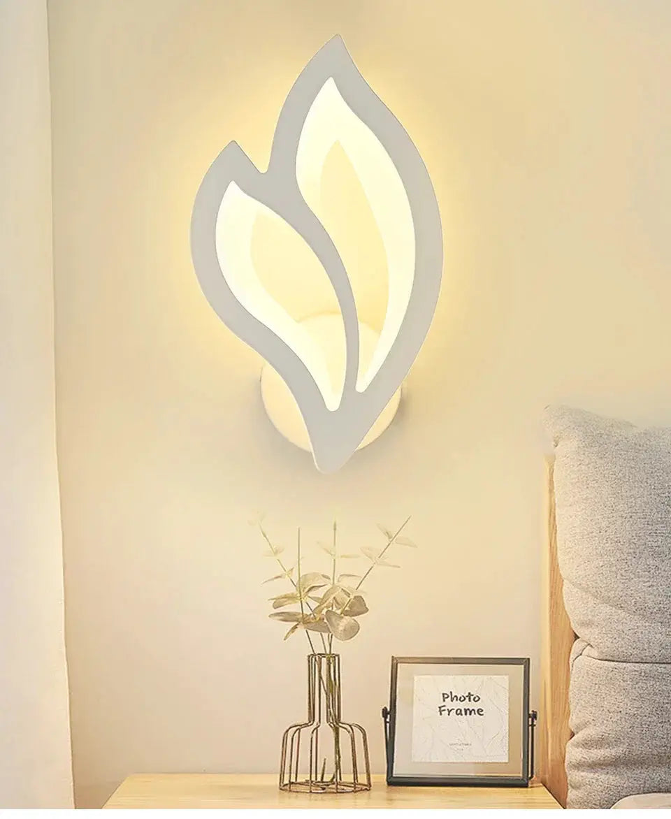 Modern LED wall lamp with leaf-shaped white frame, warm ambient light, Simples Market