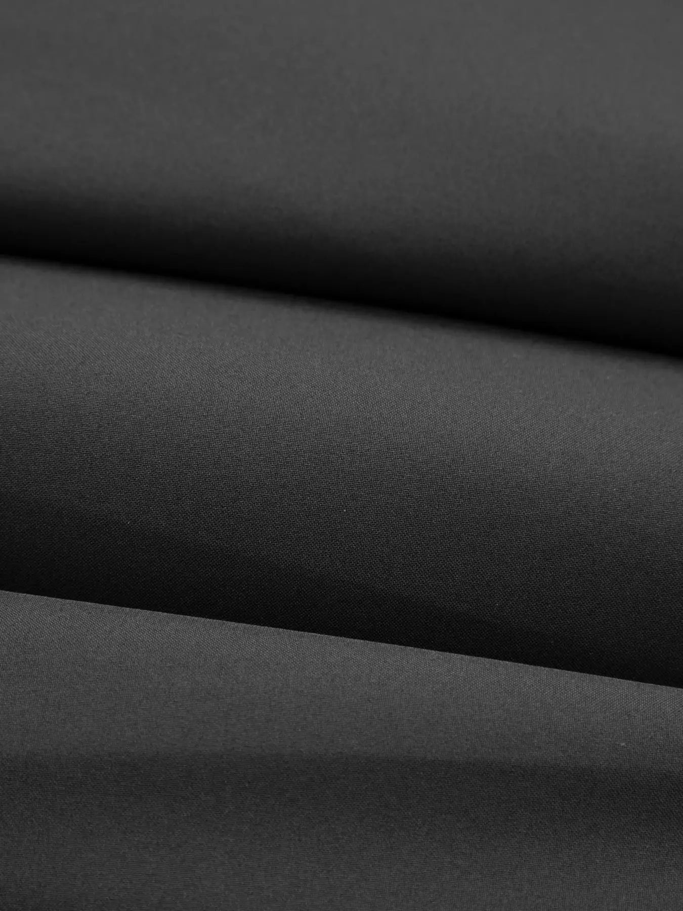 Men's cotton jacket fabric close-up in dark gray textile texture