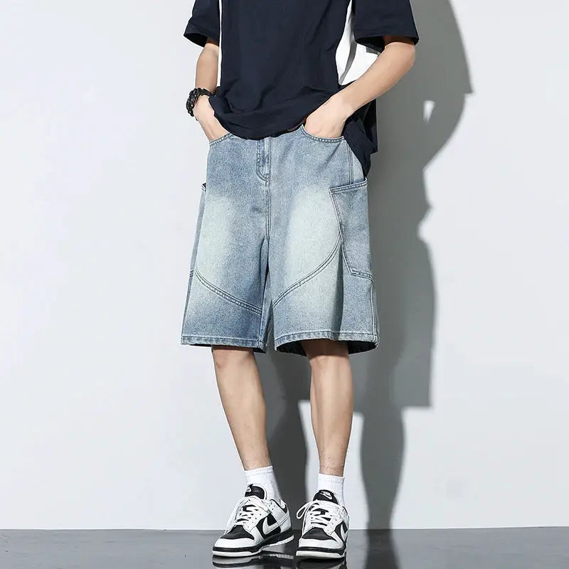 Baggy denim shorts in light vintage wash with large front pockets for casual streetwear.