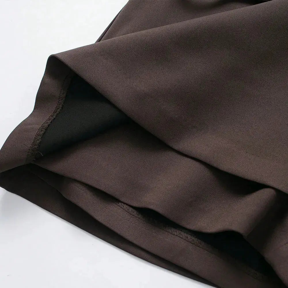 Women's brown solid-color skort fabric close-up with inner lining