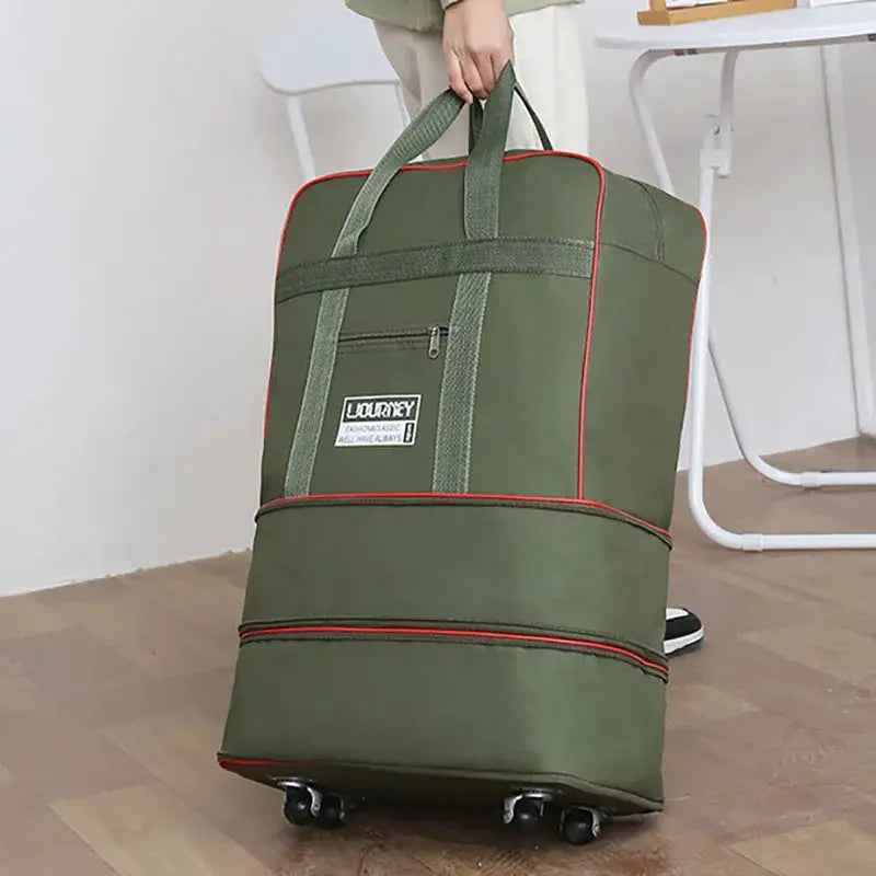 Folding travel bag on wheels, green fabric with red trim, large capacity overnight luggage