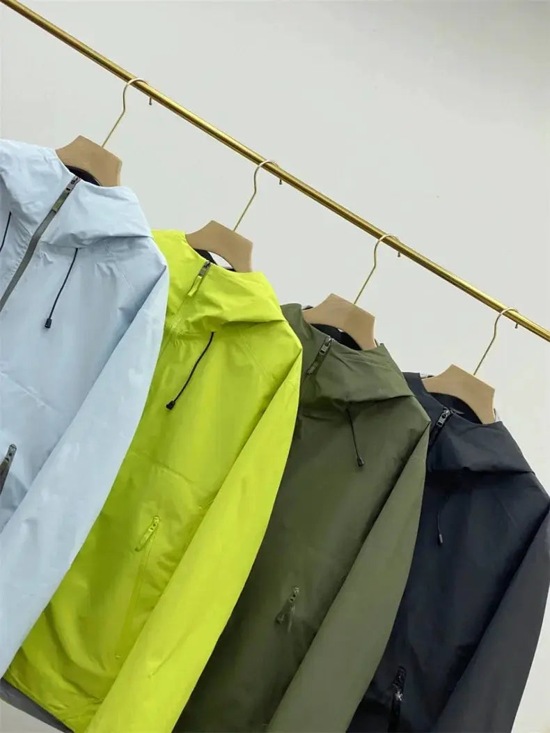 Outdoors windproof soft shell jackets by Simples Market, four jackets on hangers in light blue, neon lime, olive, navy.