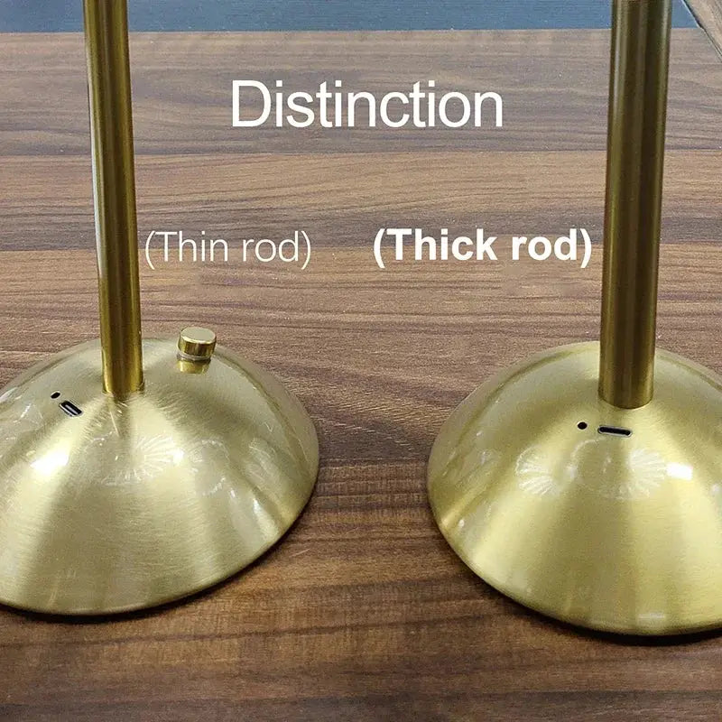 Rechargeable LED night light set with two brass-toned bedside lamps featuring thin and thick rods.