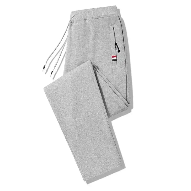 Men's grey cotton jogger track pants with elastic waist, drawstring and side zip pocket