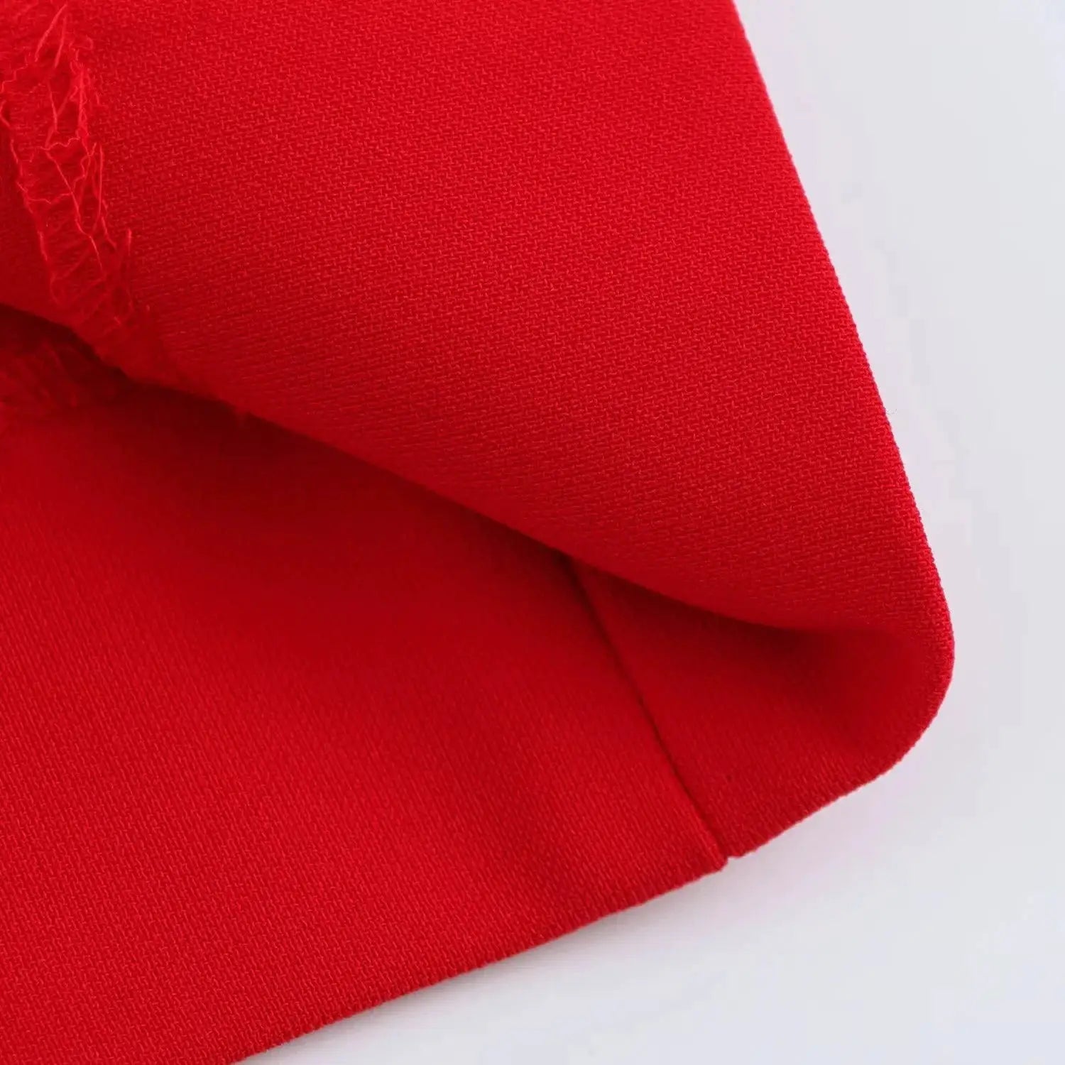 KONDALA red blazer fabric close-up showing textured weave.