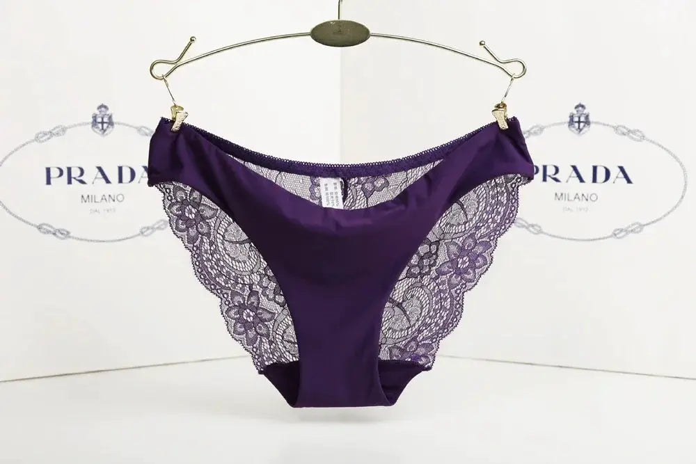 Seamless low-rise purple lace panties by Simples Market with lace side panels; Prada backdrop