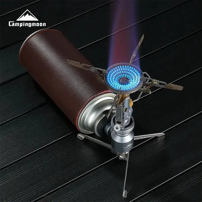 Campingmoon XD-2F portable gas stove with blue flame, windproof tripod, brown leather canister sleeve.
