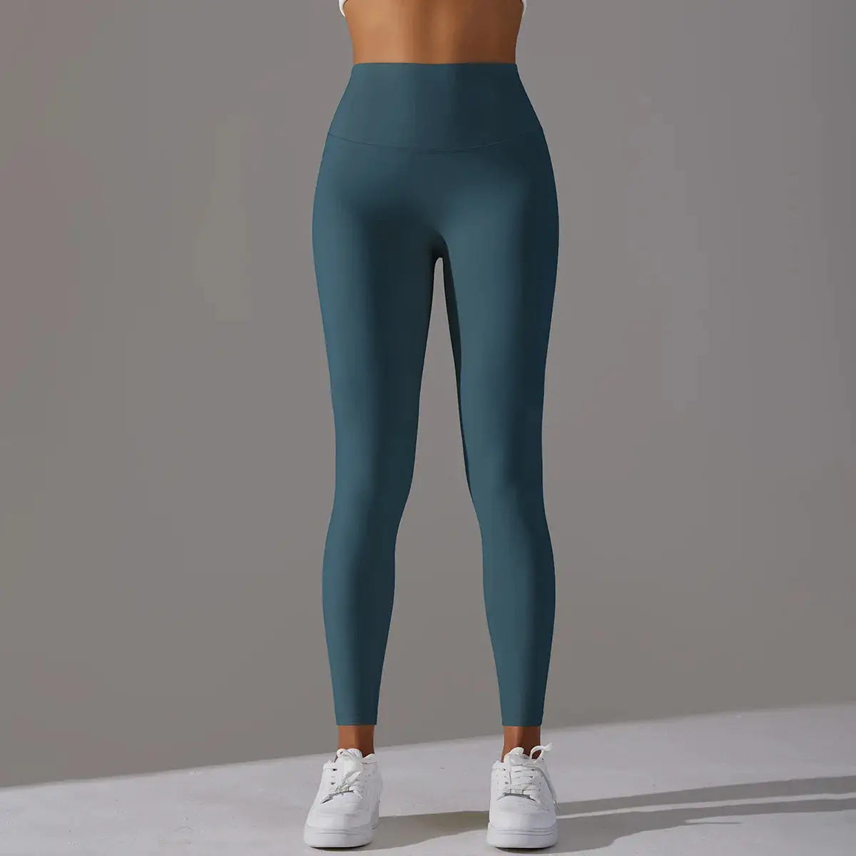 High-waist naked-feeling leggings in teal for fitness; women's full-length gym and yoga pants