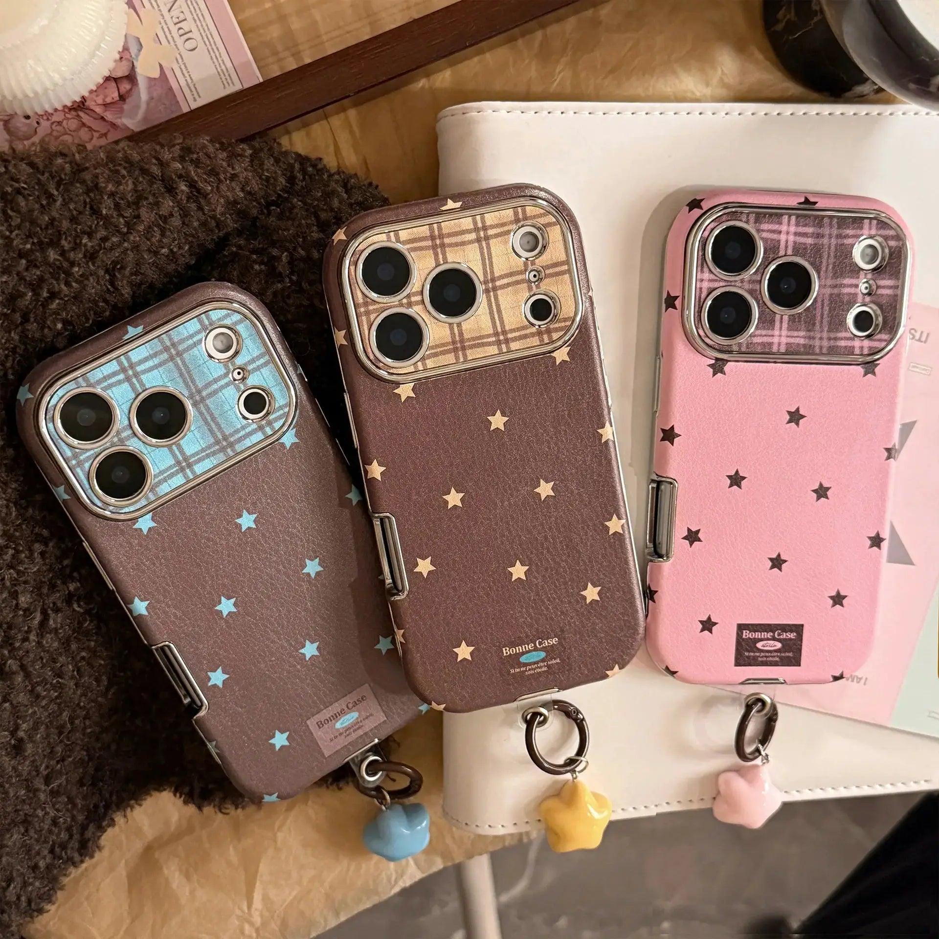 Korean Retro Stars plated leather phone cases for iPhone (blue, brown, pink) with star plaid pattern and pendant charms