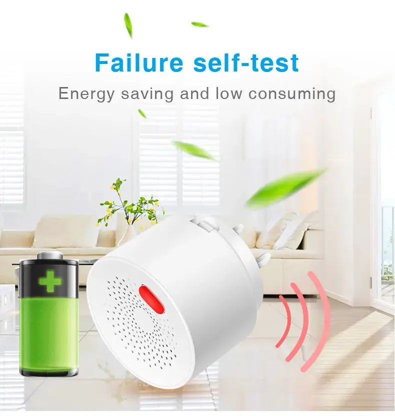 Tuya smart gas leak detector, white with red indicator; two items shown (detector + green battery) in a bright living room.