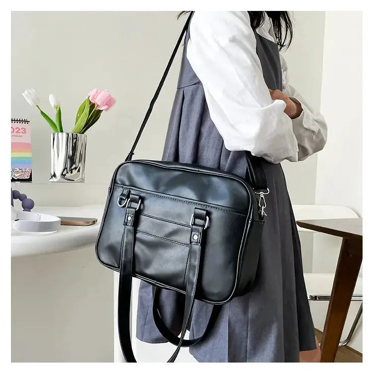 Simples Market Japanese style JK bag in black PU leather, women's shoulder crossbody handbag with front buckle straps