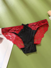 Women's lace underwear with red sheer lace and black satin color-block mid-low-rise briefs.
