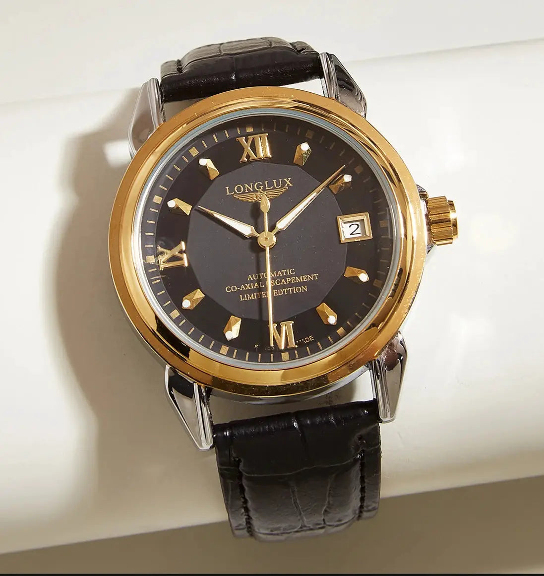 LONGLUX automatic men’s wristwatch; black dial with gold-tone bezel, leather strap, date window.