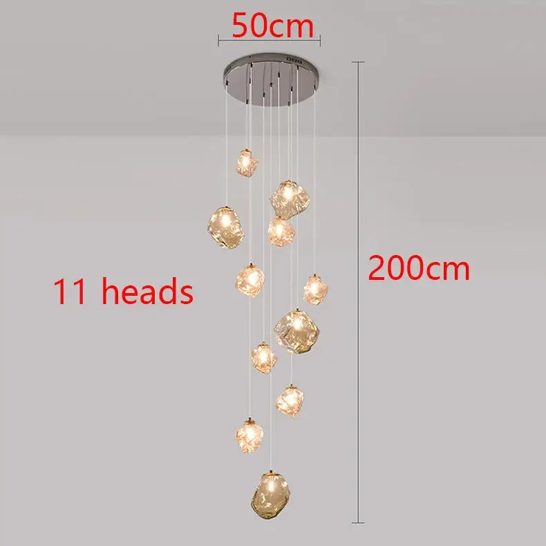 Modern LED pendant light by Simples Market with 11 hanging glass orb heads, 50cm ceiling plate, 200cm drop