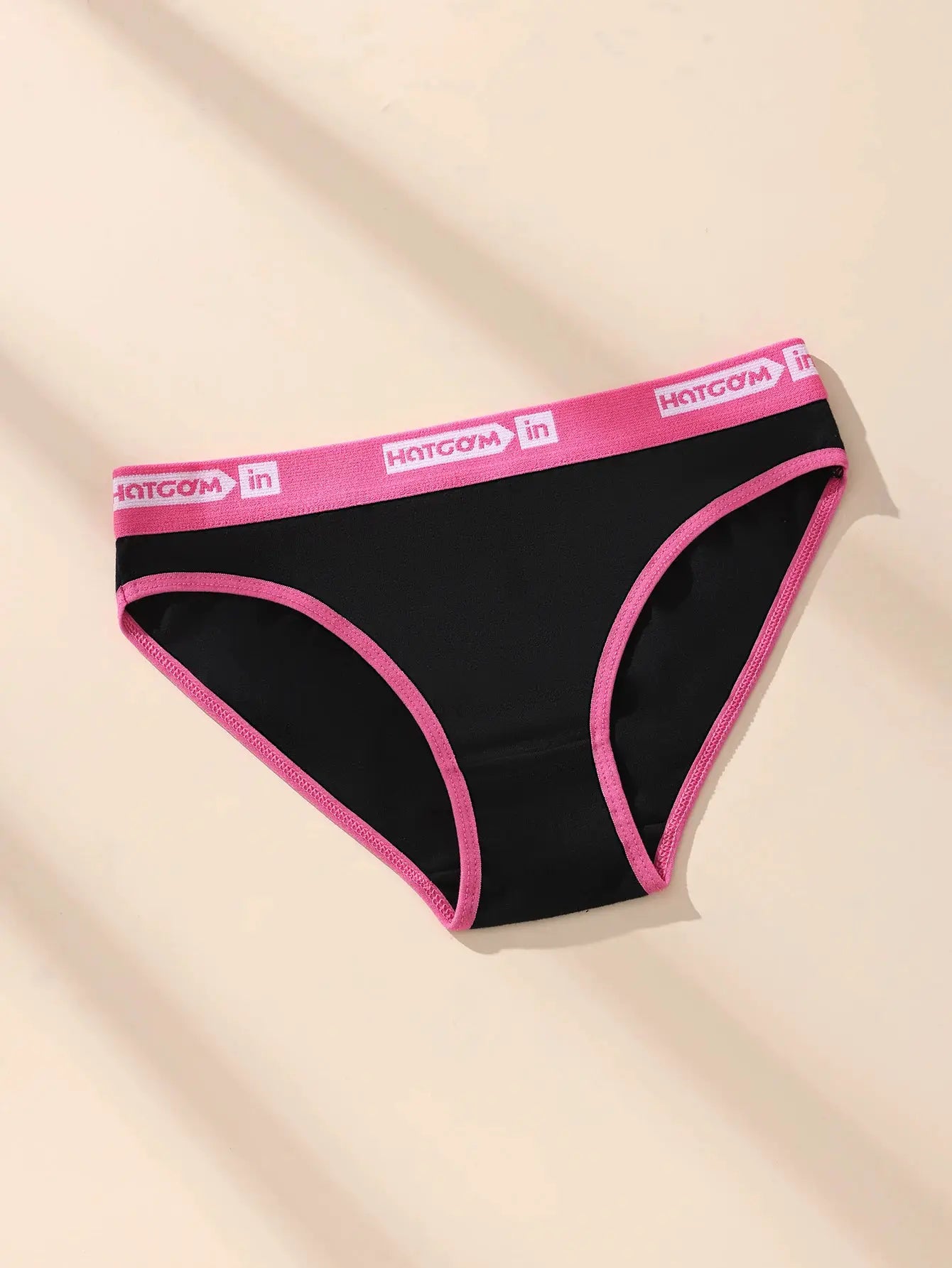 Women's cotton panties, black with pink trim and HOTCOM logo waistband.