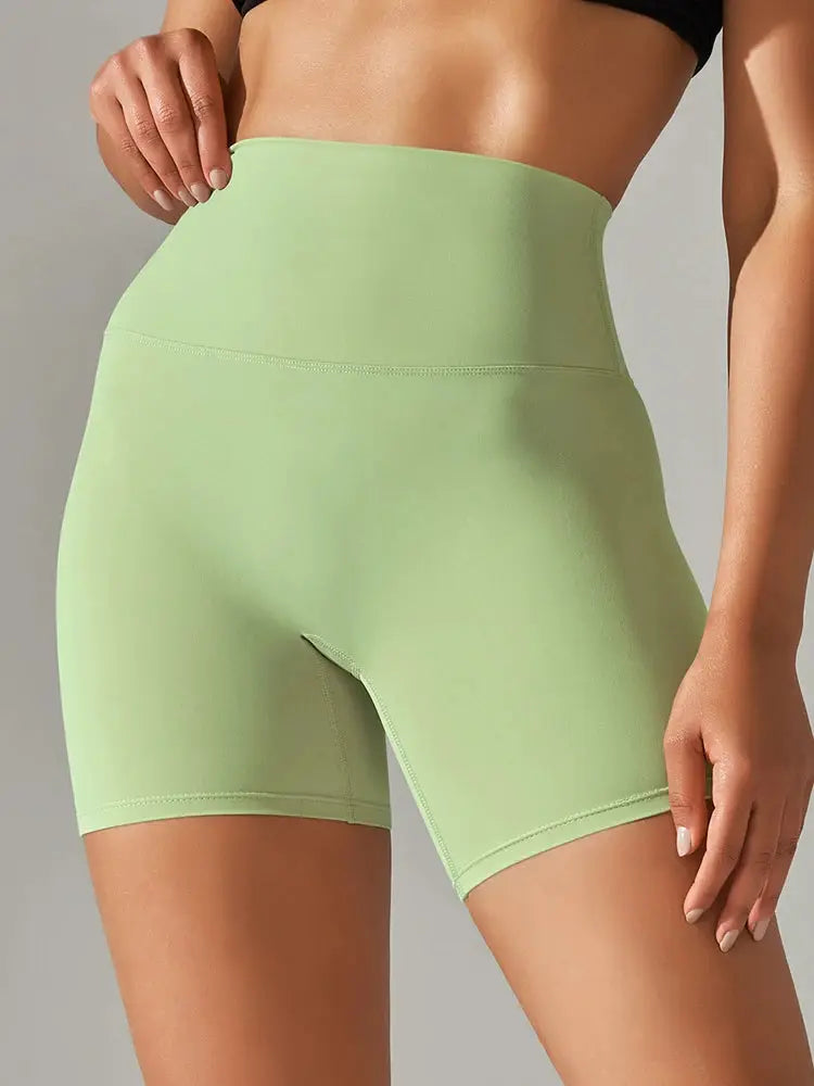 Women’s high-waist light-green athletic shorts for yoga, squat-proof and quick-drying gym wear.