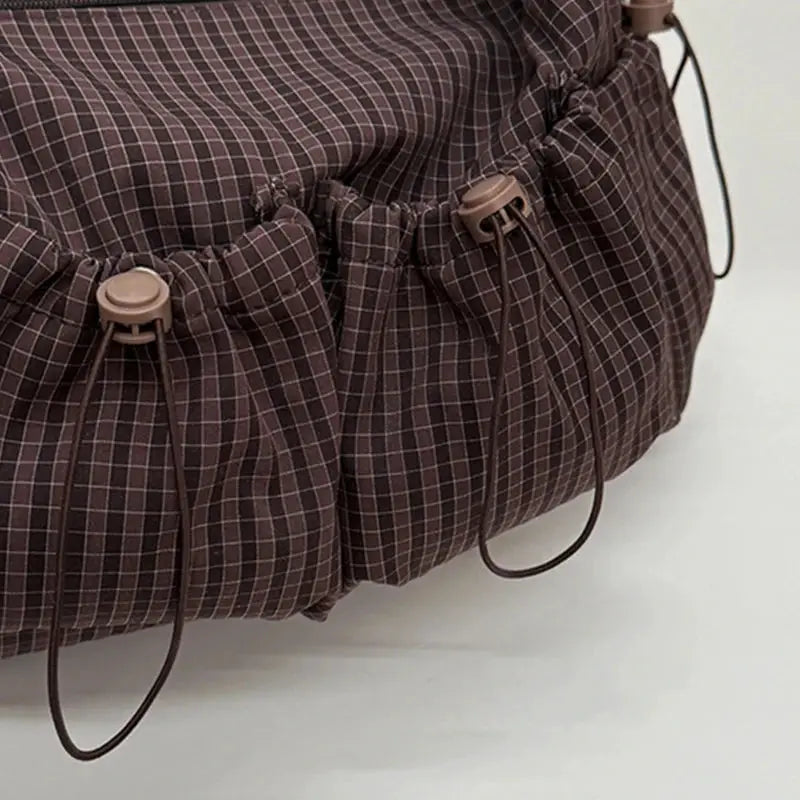 Korean nylon shoulder bag in brown plaid with drawstring closures and pleated ruched panels.
