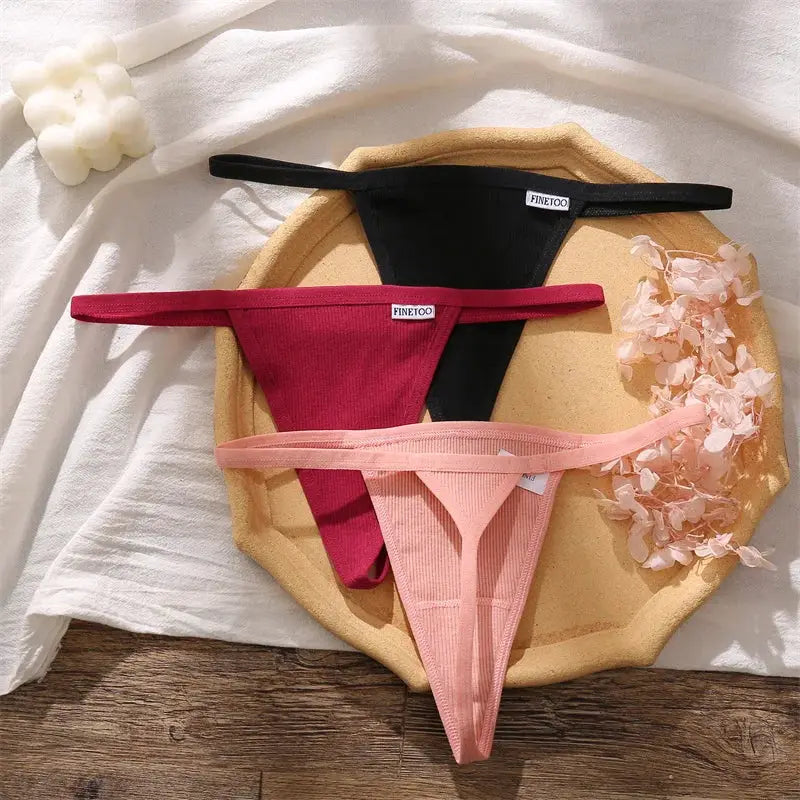 Women's cotton seamless low-rise thongs; three colors black, burgundy, blush pink; Finetoo tags.