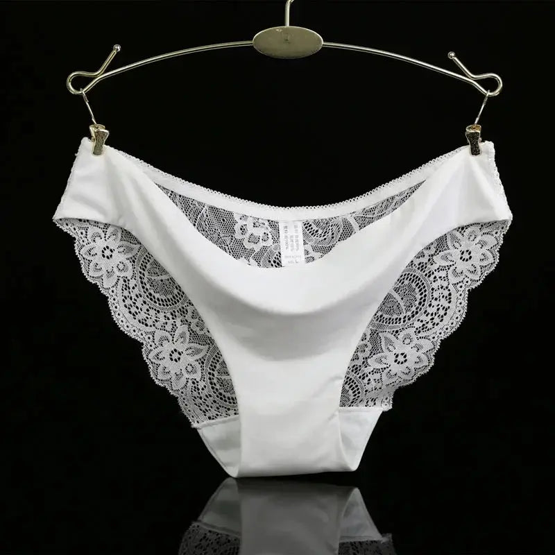 Panties, white lace low-rise with floral side panels, hanging on a display hanger
