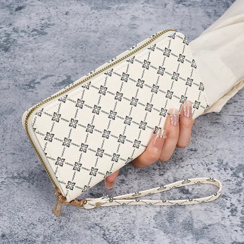 Wallet clutch in cream with black lattice print, gold zipper and wrist strap