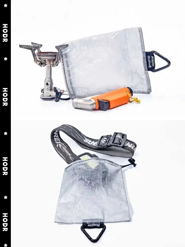 StashLite Dyneema DCF lantern diffuser stuff sack, silver ultralight bag with black strap and carabiner