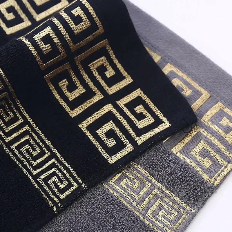 2pc towel set in black and gray 100% cotton with gold embroidered geometric pattern by Simples Market