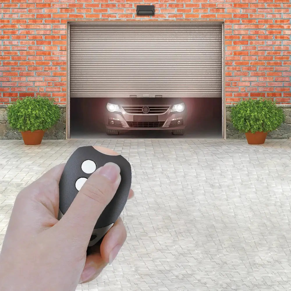 Garage door remote control with rolling code; black handheld device with two white buttons