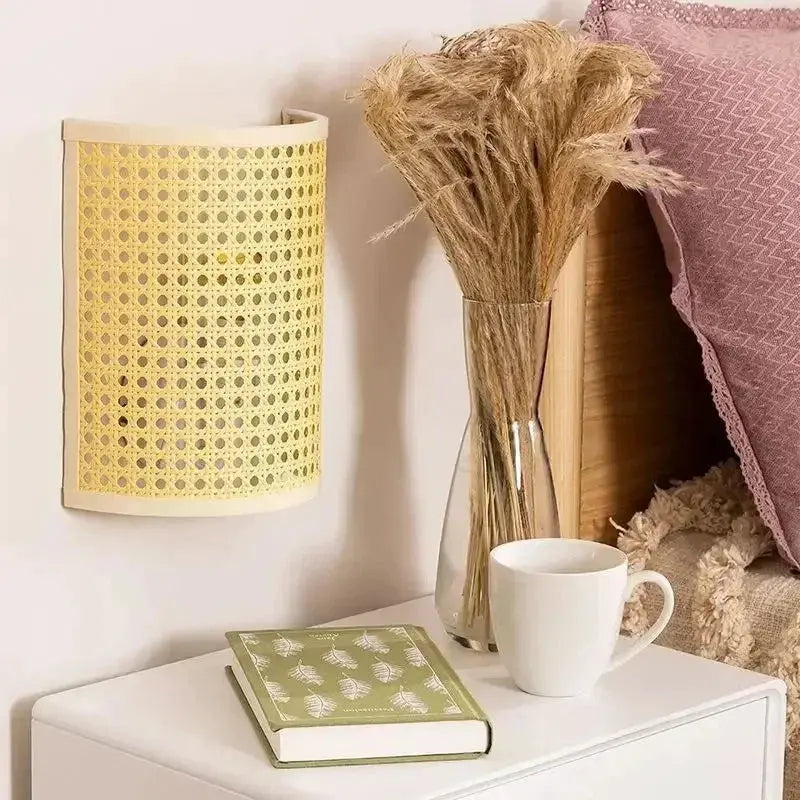 Rattan wall lamp sconce with warm LED light, beige woven shade, by Simples Market