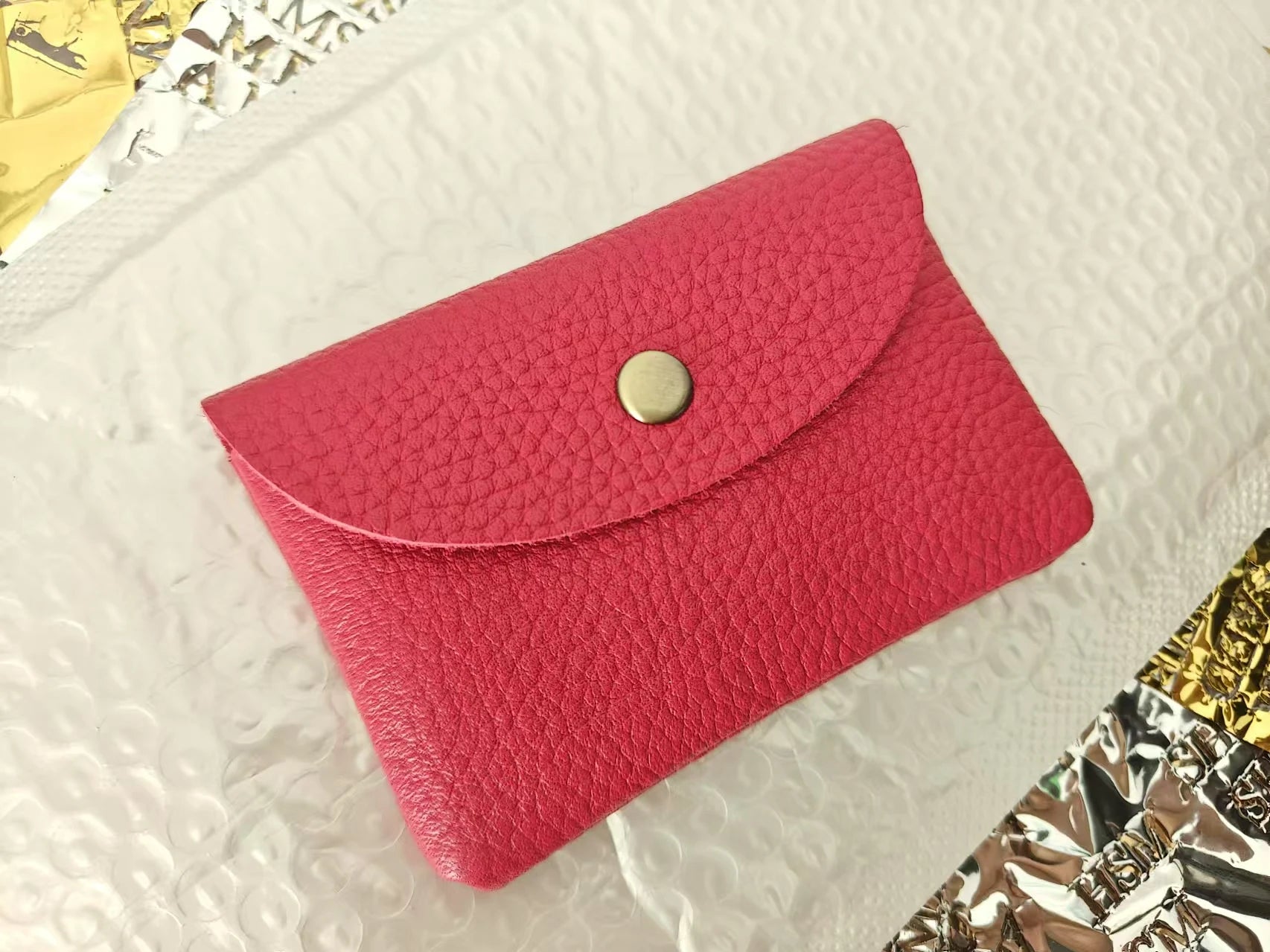 Simples Market pink genuine cowhide leather card holder with flap and metal snap.
