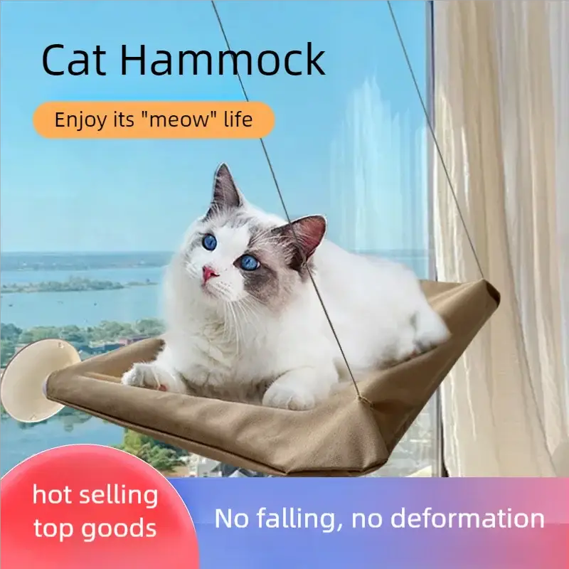 Cat hammock hanging bed by Simples Market in tan fabric, supports up to 20 kg, cat lounging by window.
