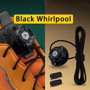 Automatic no-tie shoelace with dial for sneakers; black laces on orange athletic shoe with 2 spare tips