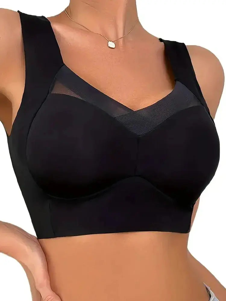 Women seamless sports bra with chest pad, black with mesh detail.