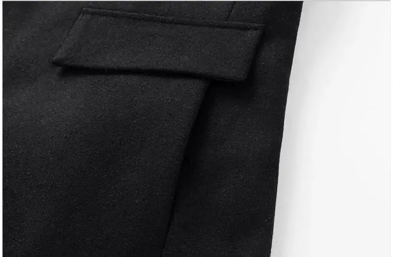 Men's black wool-blend trench coat with lapel and pocket flap.