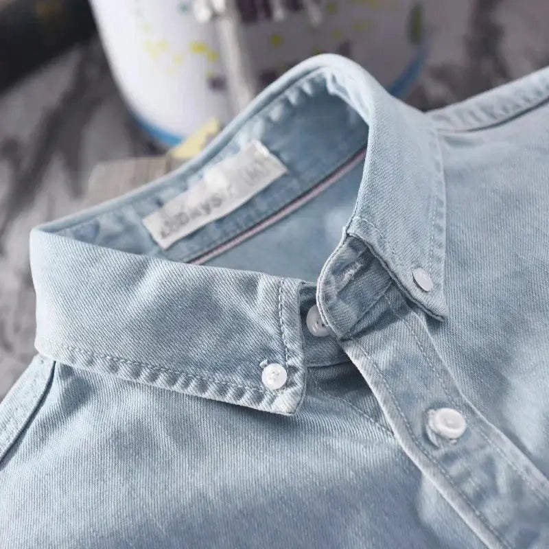 Denim shirt by Simples Market, 100% cotton light-blue, men's long-sleeve casual top.