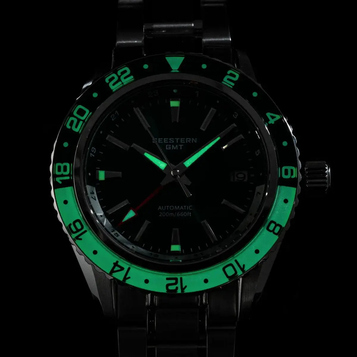 SEESTERN GMT diver watch with green bezel, black dial, sapphire glass, luminous hands, stainless steel band.