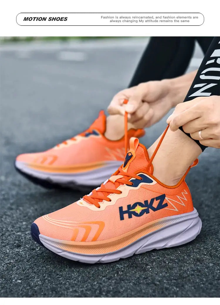 Pair of orange HOKZ running shoes with breathable mesh
