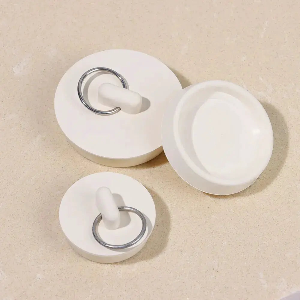White rubber drain stopper set with metal rings for sink and floor drains