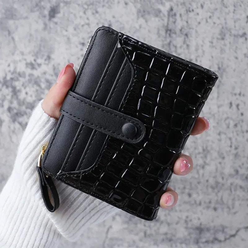 Simples Market Mini Crocodile Print Clutch Wallet in black with card slots and wrist strap.