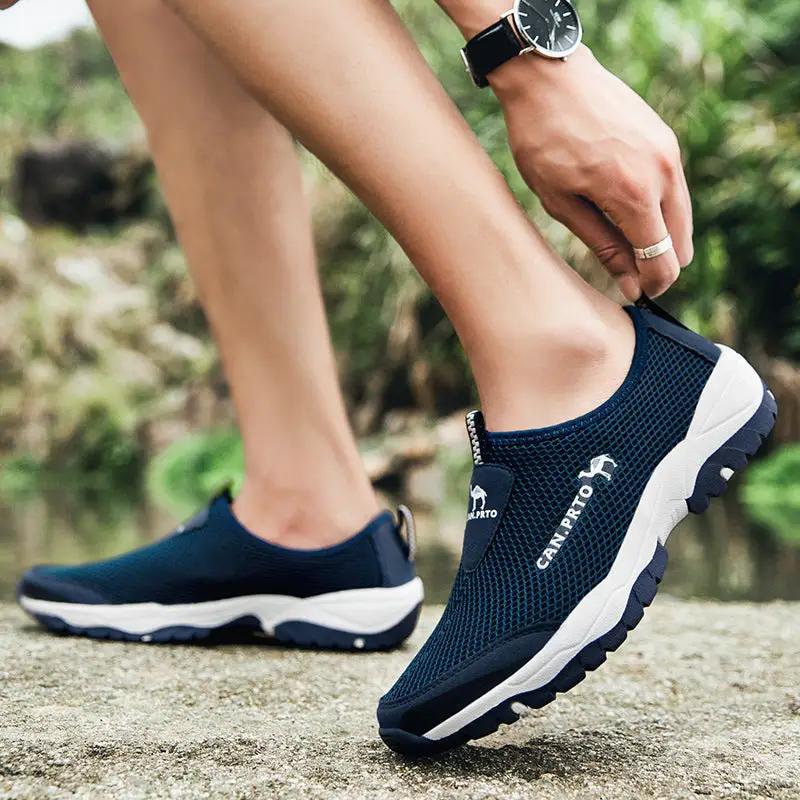 Pair of navy mesh slip-on men's casual sneakers by Simples Market, breathable outdoor footwear